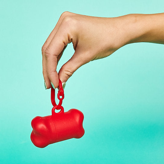 Bone shaped poop outlet bag dispenser